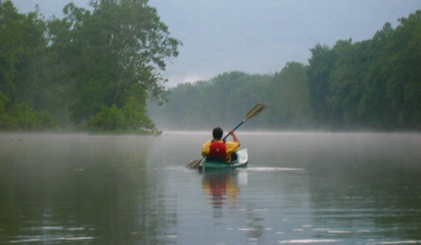 man in kayak enjoying the calm misty waterDownriver Canoe Company Shenandoah Valley River